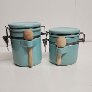 Vintage Kitchen airtight aqua canister set with wooden spoons.